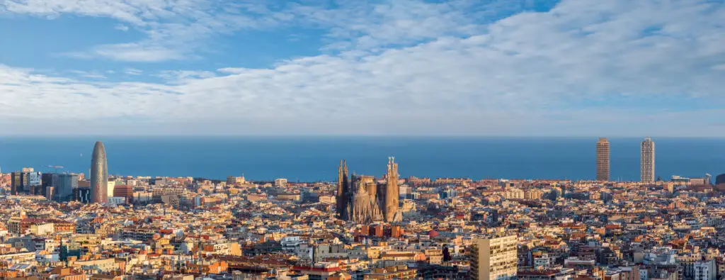 Panoramic view of Barcelona skyline with Sagrada Familia and Mediterranean Sea